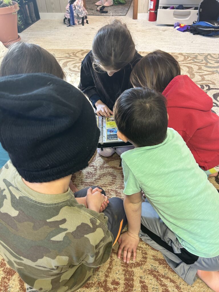 Microschool Student in Topeka, Kansas looking at a book being shared
